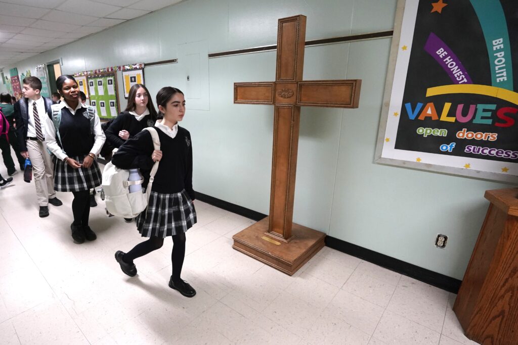 Students walk near a cross as they change classes at St. Patrick School in Smithtown, New York, January 15, 2026. Catholic Schools Week, the annual celebration of Catholic education in the U.S., is observed Jan. 25-31 in 2026. Photo: OSV News/Gregory A. Shemitz