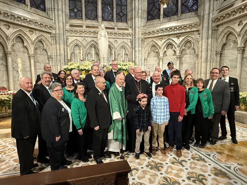 Cardinal Timothy Dolan (center, in black) greets the New York State Council of the Knights of Columbus, the leadership of the New York Columbiettes, and family members after the Mass for Life at St. Patrick’s Cathedral on Sunday, January 18, 2026.
