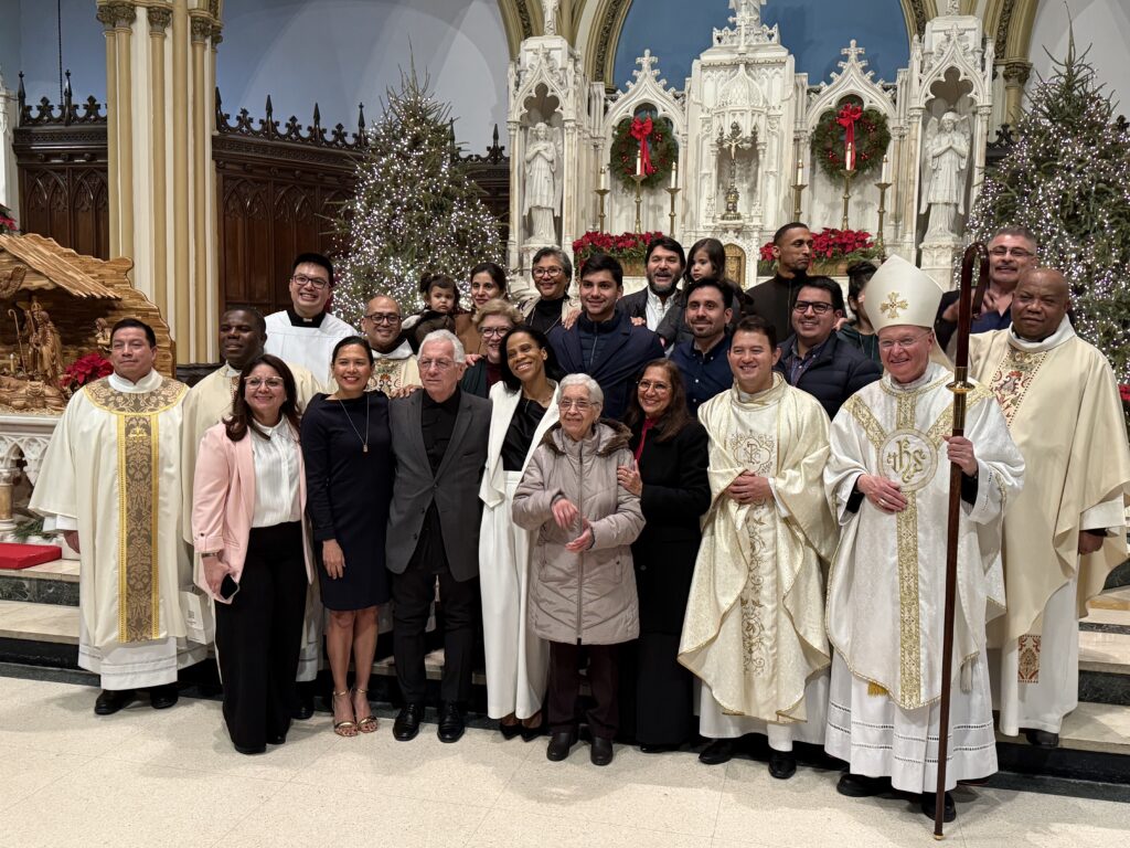 Father Carlos Limongi (front row, second right) is joined by Archdiocese of New York Auxiliary Bishop Edmund J. Whalen (front row, first right) along with concelebrants, altar servers, and members of parish staff from Holy Name - St. Gregory the Great on the Upper West Side of Manhattan following his installation as pastor of that parish.