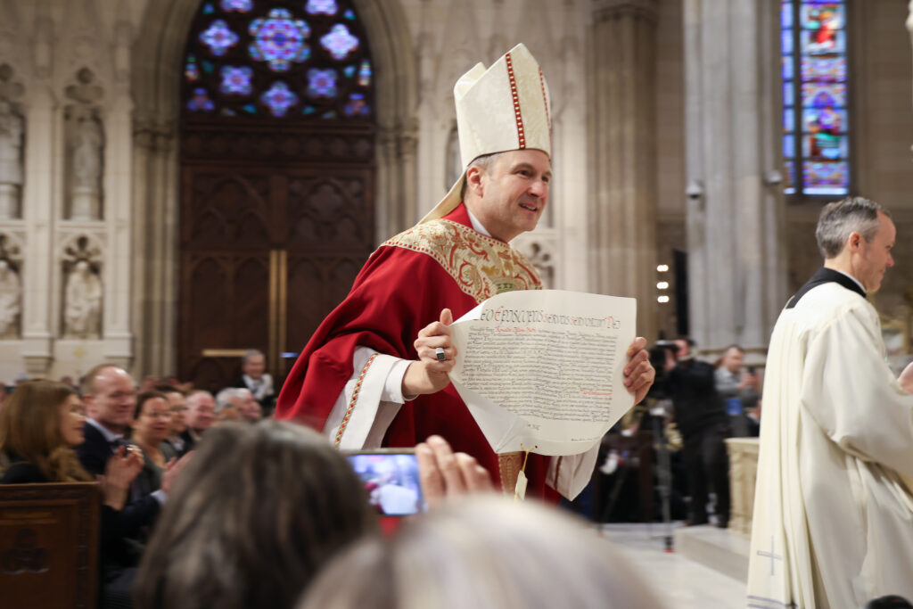 Archbishop Ronald A. Hicks displays the apostolic letter from Pope Leo XIV confirming his appointment, February 6, 2026.