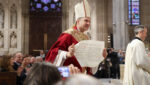 Archbishop Ronald A. Hicks displays the apostolic letter from Pope Leo XIV confirming his appointment, February 6, 2026.