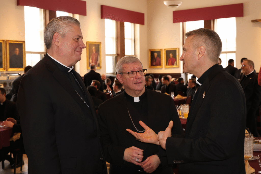 Archdiocese of New York Auxiliary Bishop John S. Bonnici (left) talks with Archbishop Ronald Hicks (right) and Auxiliary Bishop Gerardo Colacicco (center) at a farewell luncheon in Bishop Bonnici’s honor at Saint Joseph’s Seminary on February 19, 2026.