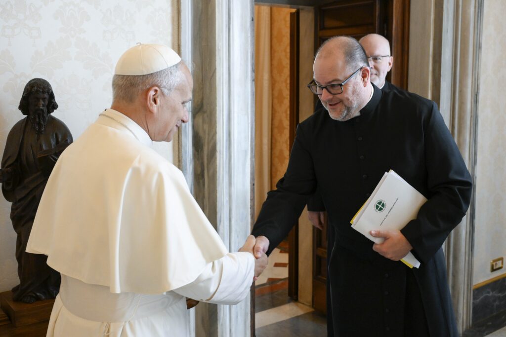 Pope Leo XIV greets Father Michael Fuller, general secretary of the U.S. Conference of Catholic Bishops, in the library of the Apostolic Palace at the Vatican October 10, 2025.