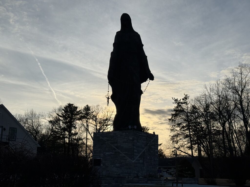 A statue of Our Lady of the Rosary stands in silhouette at the National Marian Shrine and Retreat Center in Stony Point, January 30, 2025.