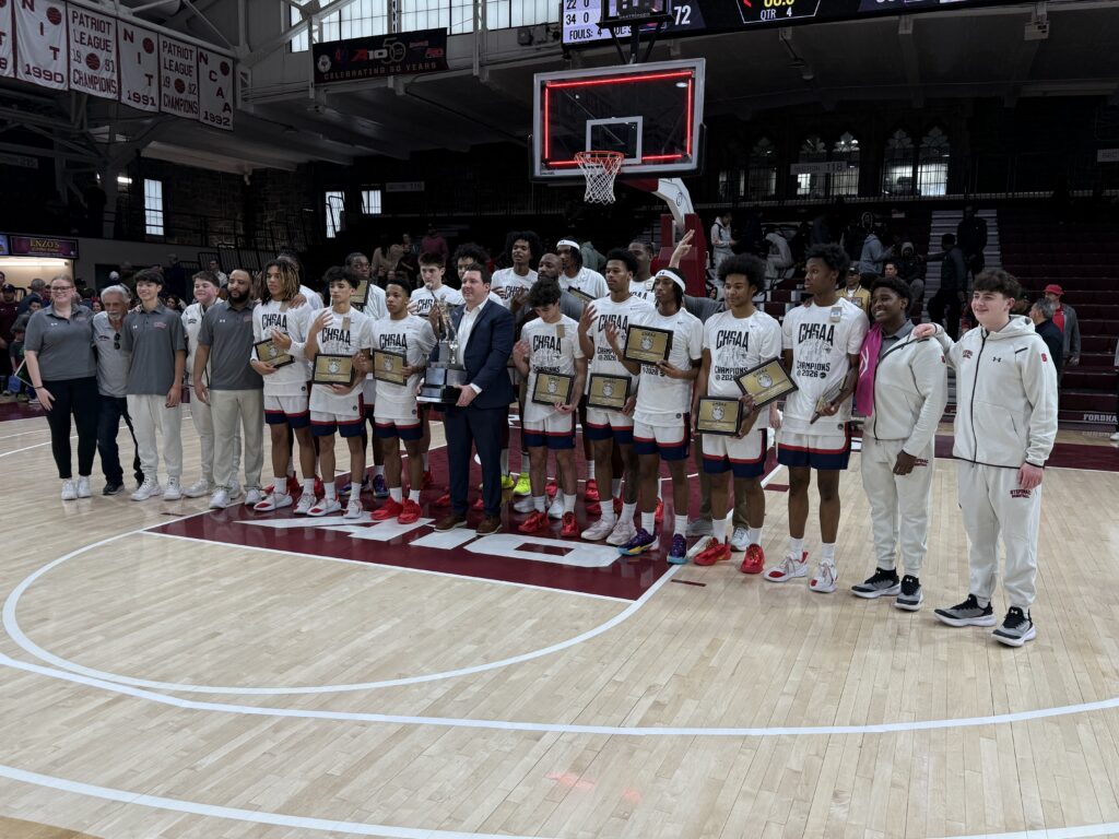 The Archbishop Stepinac High School Crusaders pose with their Catholic High School Athletic Association city intersectional trophy, March 8, 2026, at Fordham University Rose Hill Gymansium.
