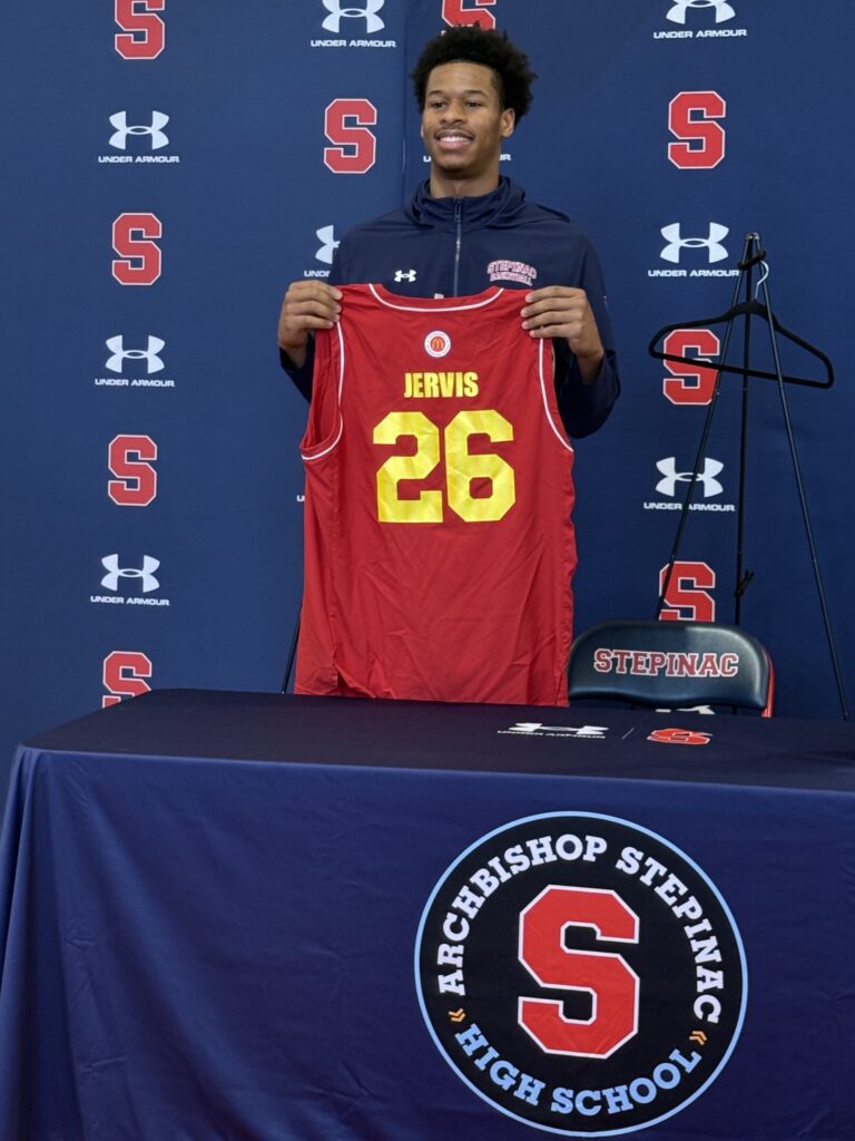 Archbishop Stepinac High School senior guard Jasiah Jervis holds his McDonald’s All-American jersey at a press conference at the White Plains campus, March 10, 2026.