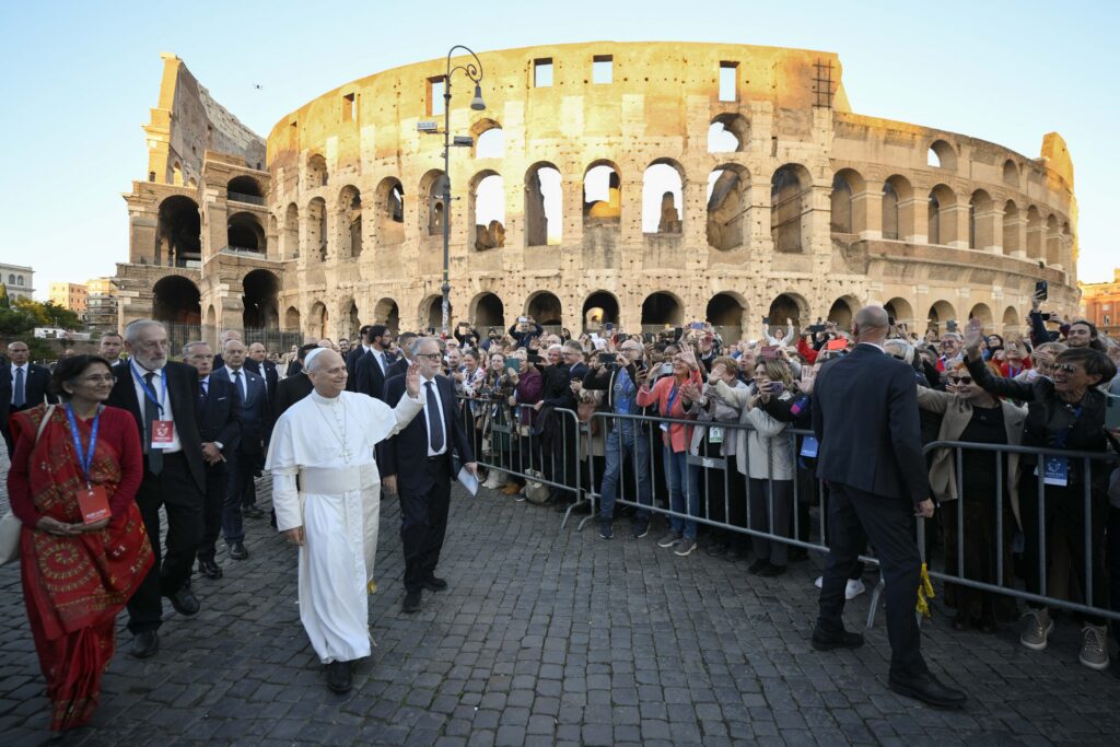 Pope Leo XIV waves to onlookers as he leaves an ecumenical Christian prayer service inside Rome's Colosseum Oct. 28, 2025. Pope Leo will carry the cross himself April 3, 2026, through all 14 stations of the Way of the Cross at Rome's Colosseum on the first Good Friday of his pontificate.