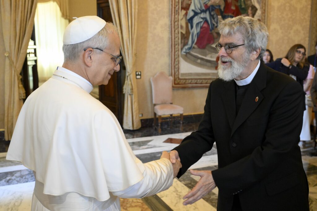 Pope Leo XIV greets Jesuit Brother Guy Consolmagno, director of the Vatican Observatory, during an audience with students enrolled in the observatory's summer school at the Vatican June 16, 2025.