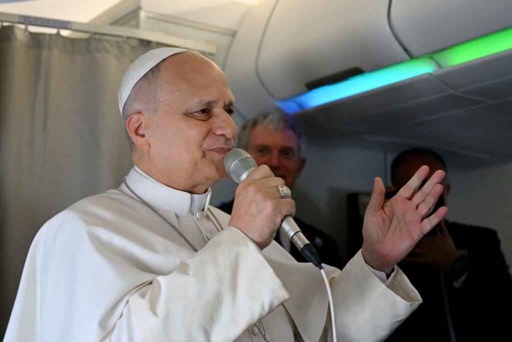 Pope Leo XIV addresses journalists during the flight heading to Algiers on April 13, 2026.