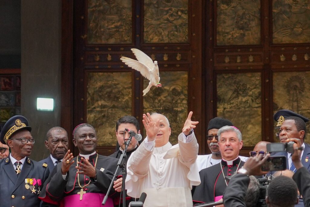 Pope Leo XIV releases a dove with community representatives at the conclusion of a peace meeting at St. Joseph Cathedral in Bamenda, Cameroon, April 16, 2026.