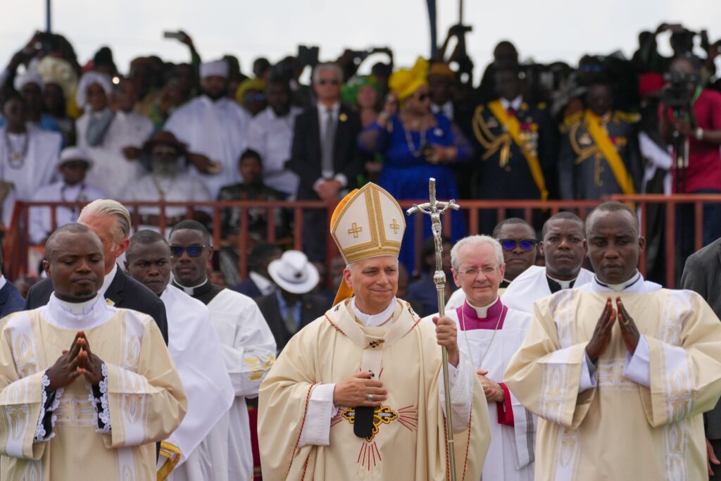 Holding his pastoral staff, Pope Leo XIV arrives in a procession to celebrate Mass outside near Japoma Stadium in Douala, Cameroon, April 17, 2026.