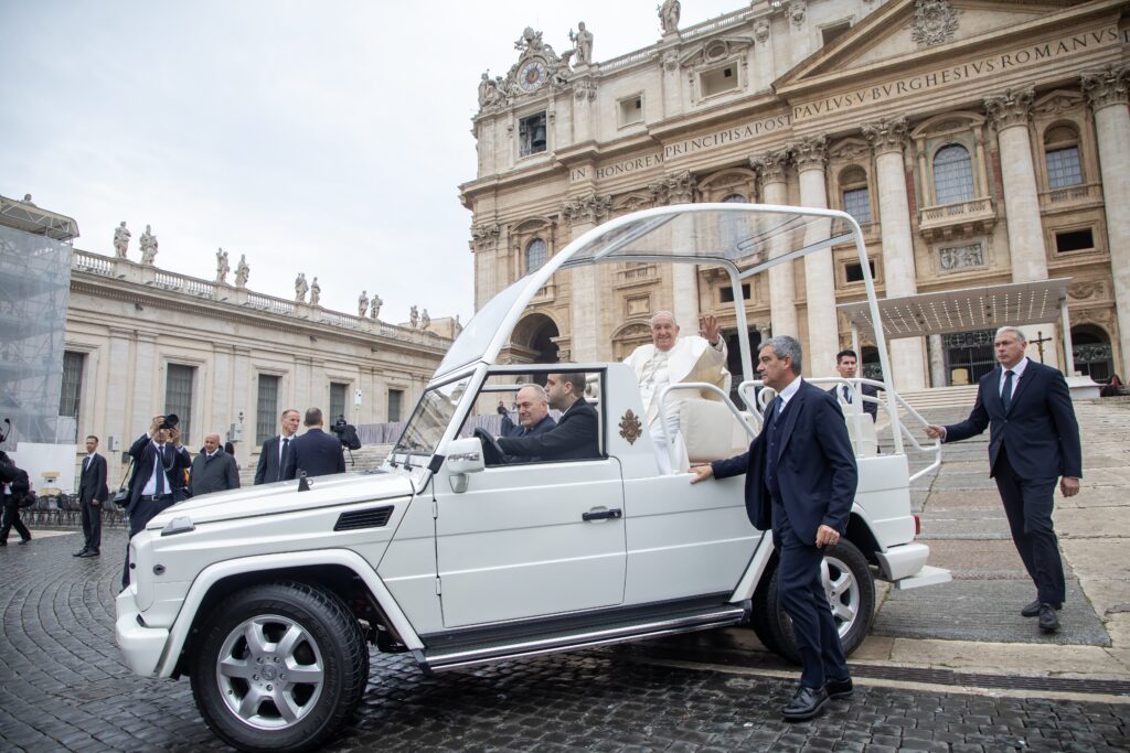 Pope Francis waves from the popemobile in St. Peter's Square at the Vatican during his weekly general audience Nov. 20, 2024.