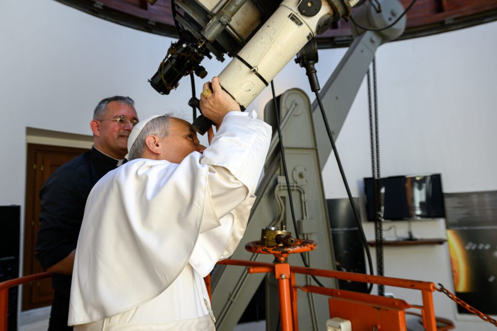 Pope Leo XIV looks through the main telescope of the Vatican Observatory in Castel Gandolfo, Italy, alongside U.S. Jesuit Father David A. Brown, an astronomer, July 20, 2025.