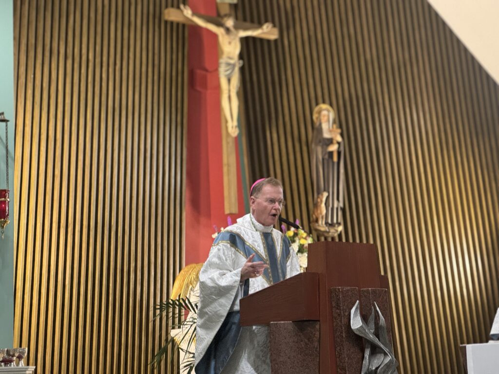 Bishop Edmund J. Whalen, vicar general of the Archdiocese of New York, addresses eighth grade students during a graduation Mass at St. Margaret of Cortuna Church in North Riverdale, May 28, 2026.