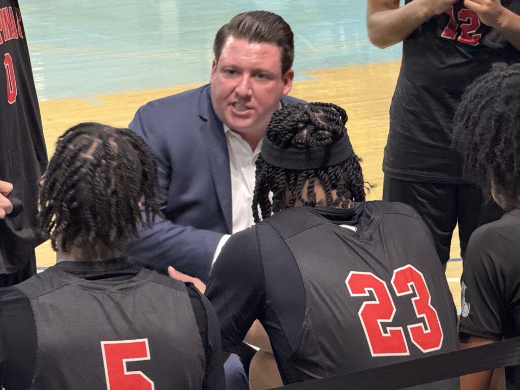 Archbishop Stepinac High School Head Basketball Coach Patrick Massaroni (center) will serve a seven-game suspension imposed by the Catholic High School Athletic Association (CHSAA) of the Archdiocese of New York, during the 2026-27 boys’ basketball season.
