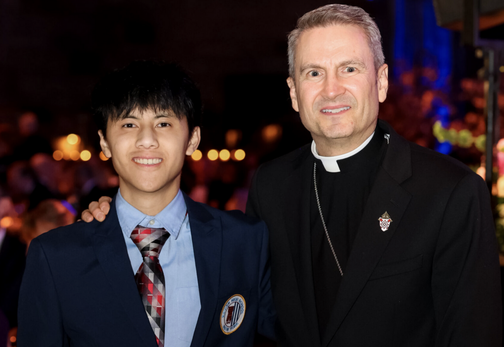 Dennis Le, a senior at Xavier High School and Inner-City Scholarship Fund scholarship recipient, stands with Archbishop of New York Ronald Hicks at the 49th Annual Inner-City Scholarship Fund FRIENDS Gala, held May 12, 2026, at Cipriani 42nd Street in Manhattan.