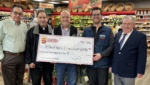 Big Deal Supermarket owner Miguel Garcia (center) presents a $6,345.20 check from this year's Lenten Fundraiser to Father Salvatore DeStefano (second from left), pastor of the Parish of St. Clare of Assisi/St. Francis Xavier and spiritual director of the AJM-Holy Name Society, at Big Deal Supermarket's gourmet produce section in Morris Park. Big Deal Supermarket Manager Jesse Clemente (second from right), Holy Name Society President Joseph Madia (far left), and Holy Name Society President Emeritus Martin Dolgow (far right) look on.