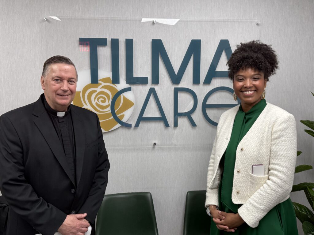 Father Richard Gill (left), CEO of Gianna’s House and pastor of the parish of St. Lawrence O'Toole and Sacred Heart in Brewster, and Nicole Moore, center director of Gianna's House Yonkers, pose at the new Tilma Care office in Yonkers at its opening on May 13, 2026.