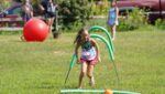 A girl navigates an obstacle course at Camp Alvernia in Centerport, July 26, 2020.