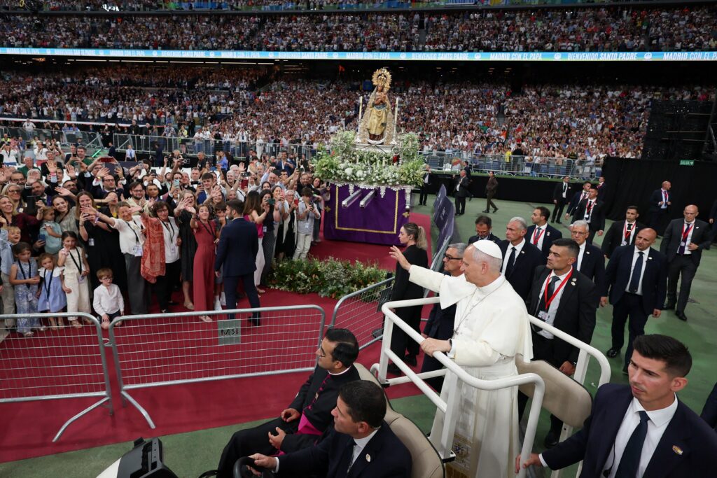 Pope Leo XIV waves as he arrives for a meeting with the diocesan community at the Santiago Bernabeu Stadium in Madrid June 8, 2026, during his June 6-12 apostolic journey to Spain.