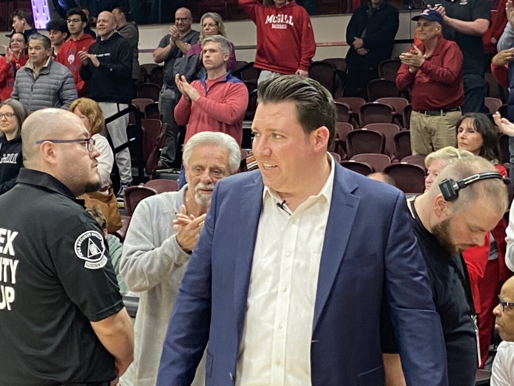 Patrick Massaroni (center) smiles after the Archbishop Stepinac High School Crusaders defeated the Archbishop Stepinac High School boys' basketball team defeated Nazareth Regional High School, 66-51, at Fordham University's Rose Hill Gymnasium to claim their second consecutive CHSAA AA City Championship on March 10, 2024.