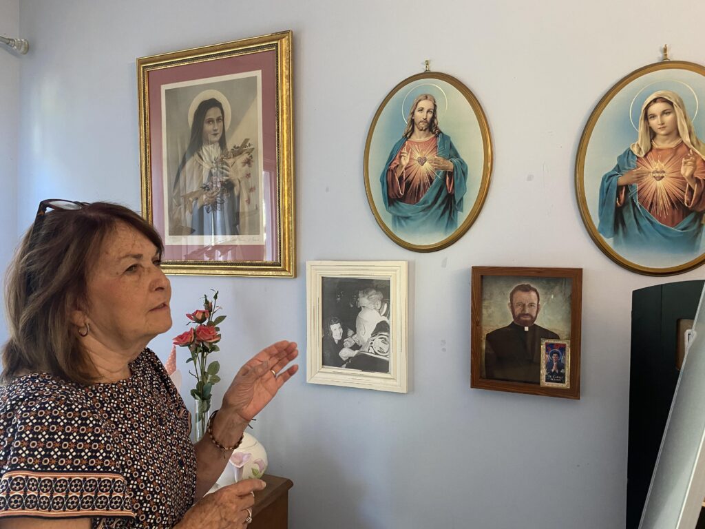 Ann O’Neill shares with a visitor the meaning of religious images that fill her home. It has been 50 years since Mother Elizabeth Ann Seton was declared a saint Sept. 14, 1975, a process aided by O’Neill's miraculous childhood healing.