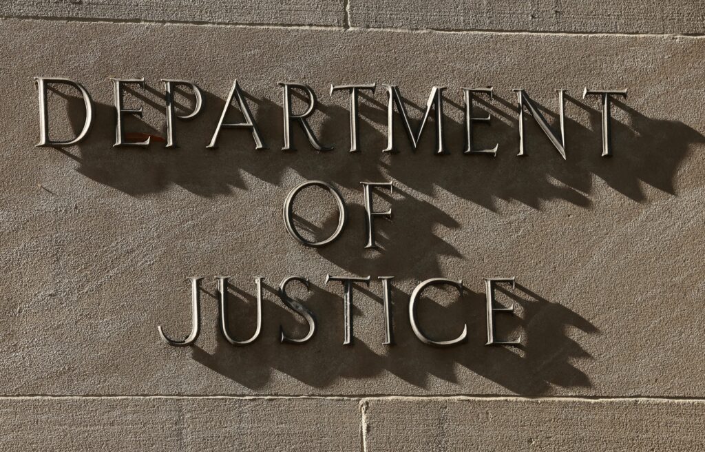 A sign for the U.S. Department of Justice in Washington is seen in this April 6, 2026, file photo.