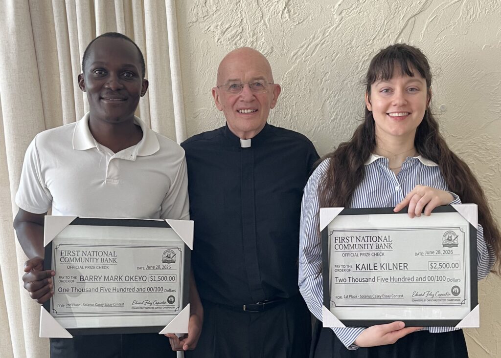 Capuchin Franciscan Father Edward Foley, vice postulator of the sainthood cause of Blessed Solanus Casey, center, stands with Barry Mark Okeyo, left, and Kaile Kilner, right, in an undated photo. Okeyo and Kilner, both studying at Catholic Theological Union in Chicago, won second and first place, respectively, in the 2025-2026 contest for the Blessed Solanus Casey Essay Prize. Third place went to César A. Cruz, a doctoral student at the Pacific School of Religion in Berkeley, Calif.