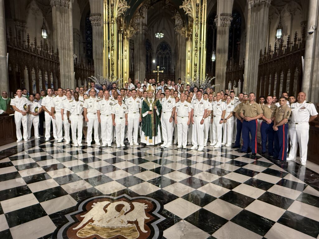 Archbishop Ronald Hicks (center, in green vestments) poses with men and women from the U.S. Navy and U.S. Marines who attended Mass at St. Patrick’s Cathedral on July 5, 2026. Most of the active-duty personnel were in New York for Independence Day celebration and the Sail250 marine parade.
