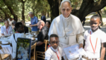 Pope Leo XIV poses for a photo with two young boys at a lunch with vulnerable people from the Diocese of Rome at Borgo Laudato Si, in the pontifical gardens of Castel Gandolfo, Italy, July 11, 2026.