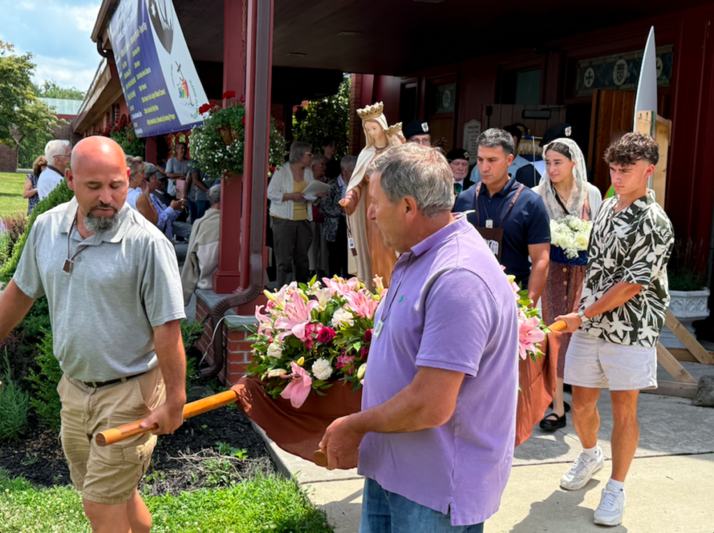 Pilgrims carry a statue of Our Lady of Mount Carmel on her feast day, July 16, 2025, in Middletown. Photo: Steven Schwankert/The Good Newsroom