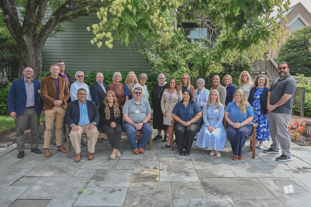 Sr. Mary Grace Walsh, ASCJ, Ph.D., Superintendent of Schools, joins the newly appointed principals and members of the Superintendent of Schools Office staff during the Principal Onboarding program held August 11–13 at Windrose on Hudson in Ossining, New York. The three-day program prepared the new school leaders for the 2026–2027 academic year through formation in Catholic identity and in spiritual, academic, and administrative leadership, along with prayer, reflection, and a commissioning service. Photo courtesy of the Superintendent of Schools Office.