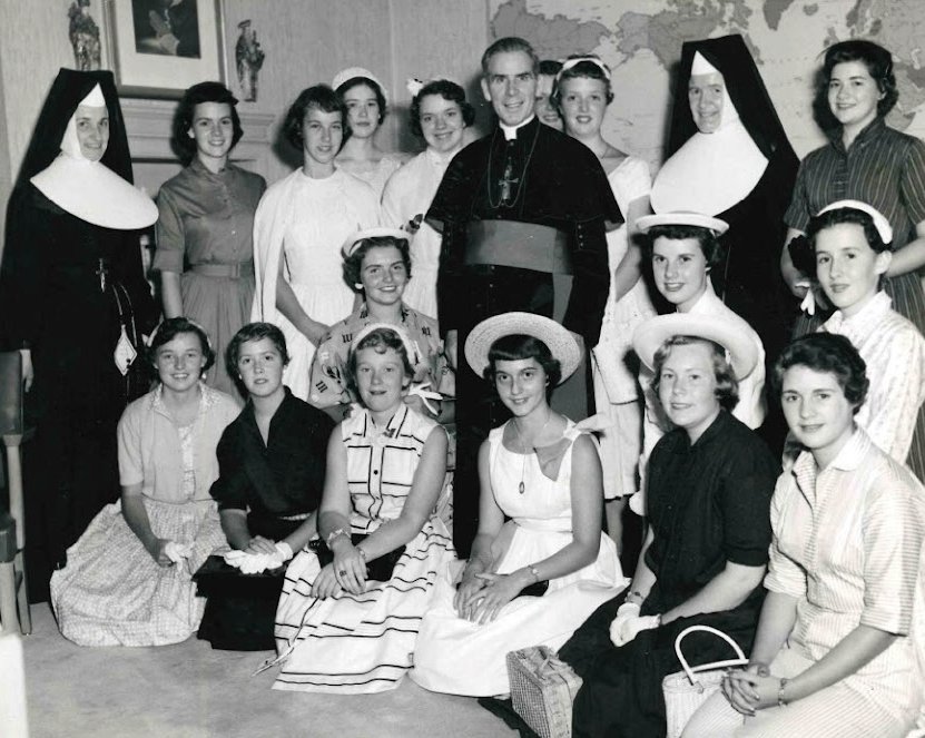 Archbishop Fulton J. Sheen is seen in an undated photo posing with women who worked at the Society for the Propagation of the Faith in Manhattan.