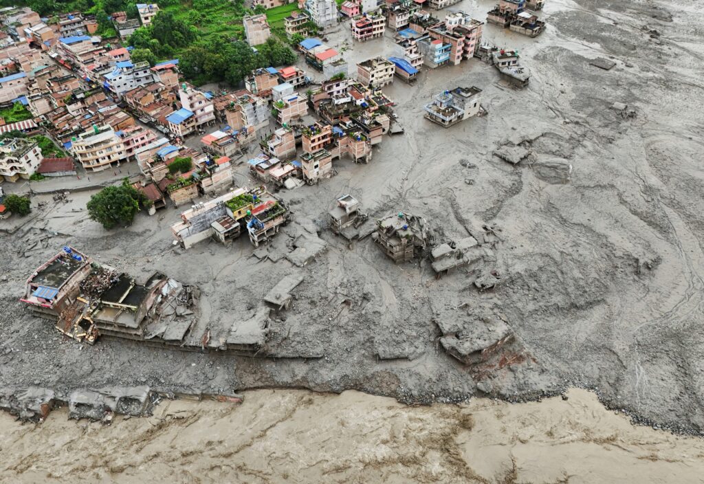 A drone view shows mud covering properties at Trishuli in Nepal's Nuwakot district Aug. 27, 2026, following devastating floods. Massive flash floods in a border area of Nepal and China killed at least 160 people and left hundreds of tourists, workers and others missing after suddenly sweeping through communities and halting travel in some areas Aug. 26. Experts said a glacial collapse caused the disaster in the warming Himalayan region. Photo: OSV News photo/Navesh Chitrakar, Reuters