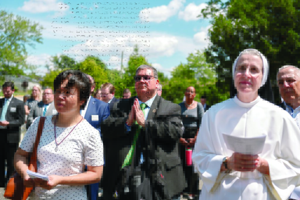 The faithful pray during the Aug. 26, 2026, blessing of the St. John Paul II retreat house in Washington. Prior to the blessing, a Mass of dedication was celebrated on the feast of Our Lady of Czestochowa, honoring her, and a litany was prayed invoking the Blessed Virgin Mary's intercession.