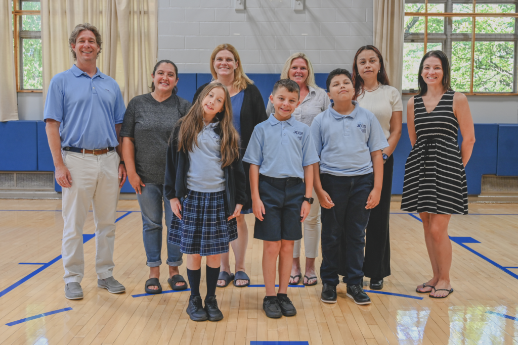 Jennifer Iannazzo, M.Ed., Principal of the John Cardinal O’Connor School, is pictured at left center with students and families as the school prepares to welcome the 2026–2027 school year with its new two-pathway model.