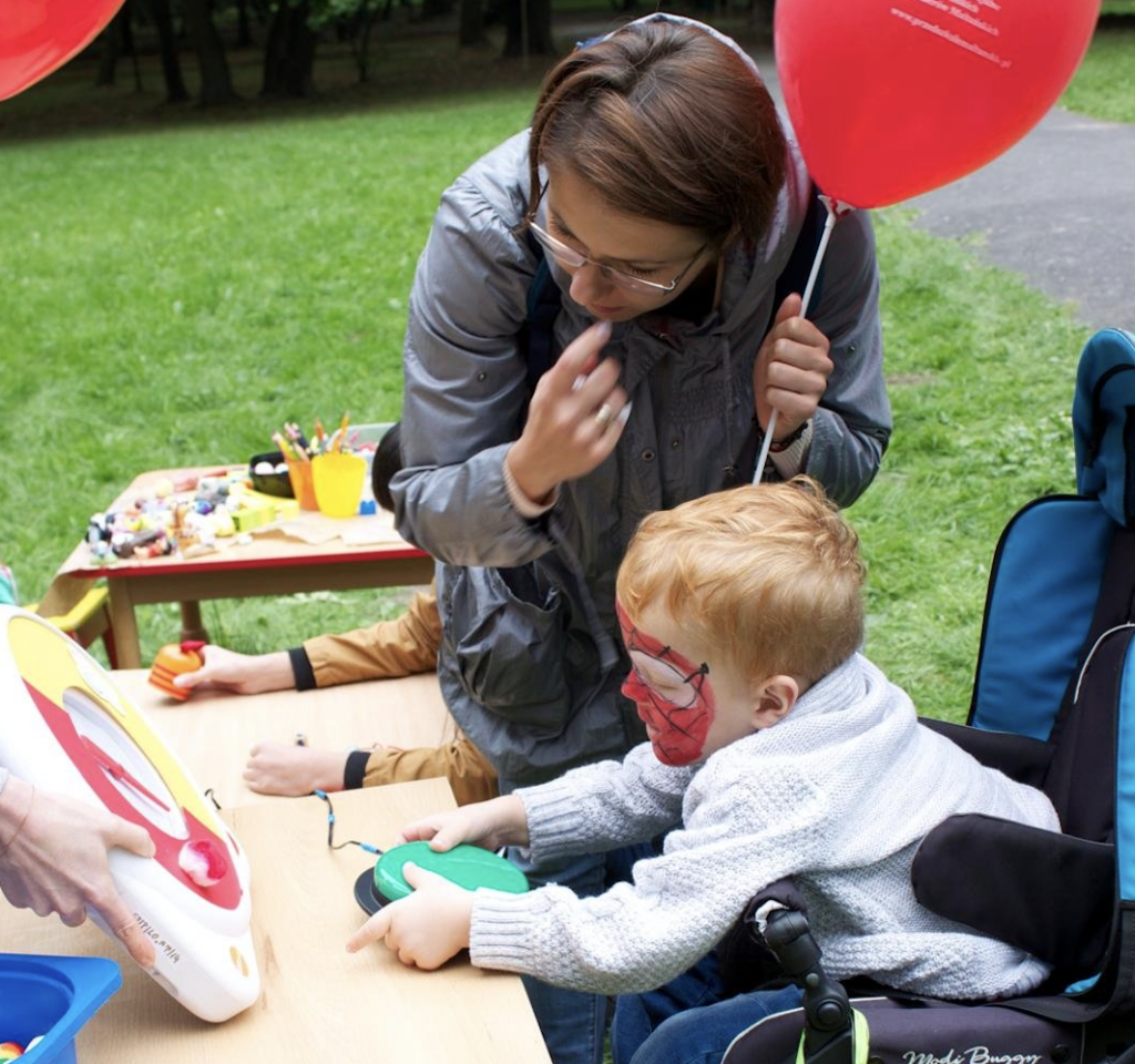A therapist assists a child during activities of the Maltese Center for Assistance to Disabled Children and Their Families in an undated photo. The center in Kraków, Poland, is operated by the Foundation of the Order of Malta.