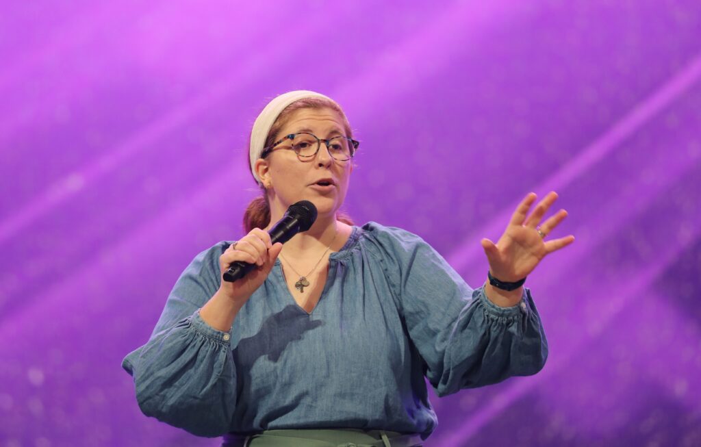Emcee Katie Prejean McGrady speaks during a July 19, 2024, impact session at Lucas Oil Stadium during the National Eucharistic Congress in Indianapolis.