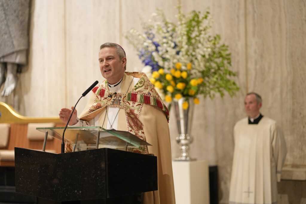 Archbishop Ronald A. Hicks delivers his reflection during the annual prayer service for United Nations diplomats at Holy Family Church in Manhattan on Sept. 8, 2026, as Fr. John McCarthy looks on. The event, hosted by the Vatican's Permanent Observer Mission to the U.N., took place on the opening day of the 81st session of the U.N. General Assembly.