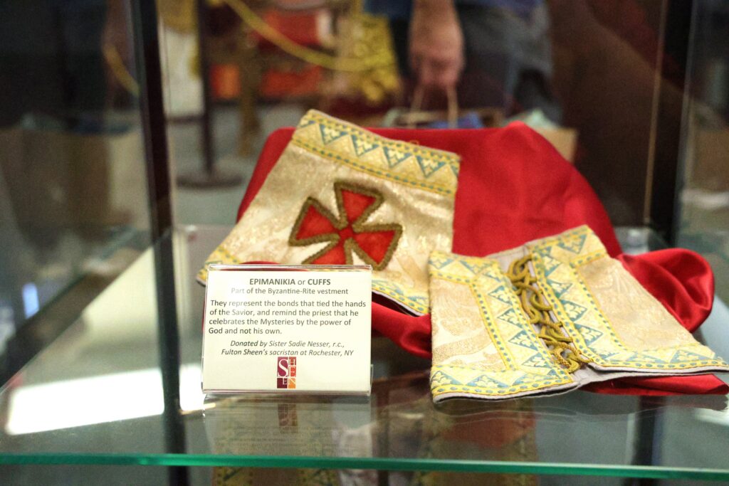 When Blessed Fulton J. Sheen celebrated the Divine Liturgy, he wore these "epimanikia," or cuffs, which represent the bonds that tied the hands of Christ, seen displayed Sept. 23, 2026, at the Sheen Museum in Peoria, Ill.