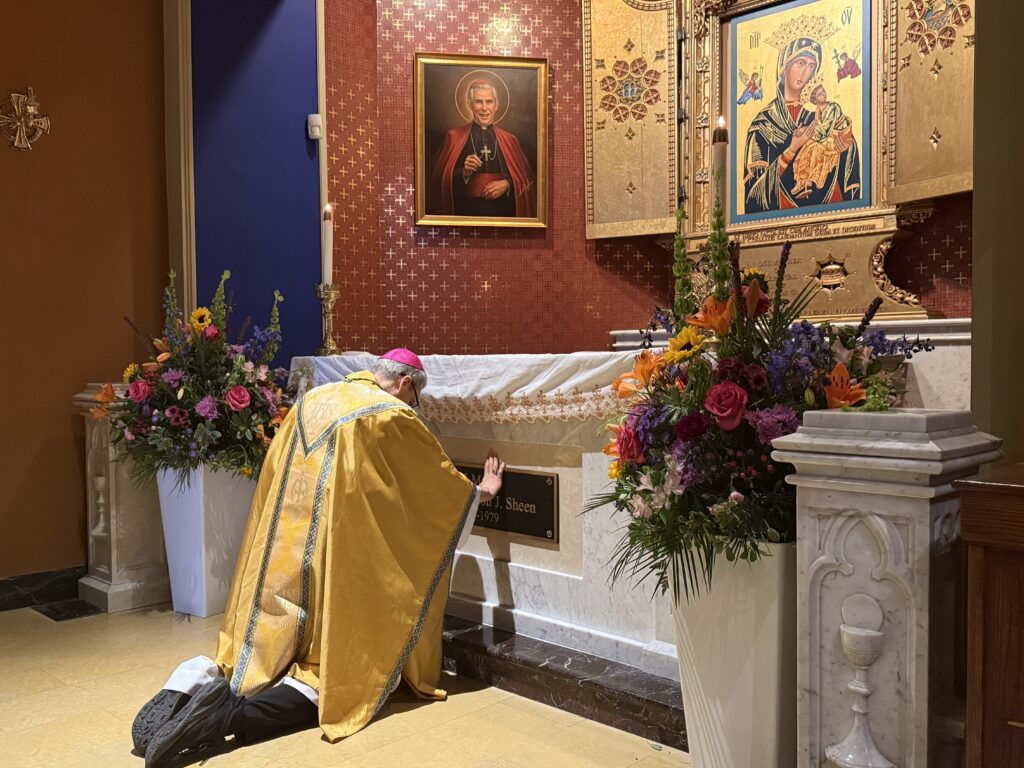 Archbishop Ronald Hicks prays at the tomb of Blessed Fulton Sheen at the Cathedral of St. Mary of the Immaculate Conception in Peoria Ill., on Sept. 25, 2026.