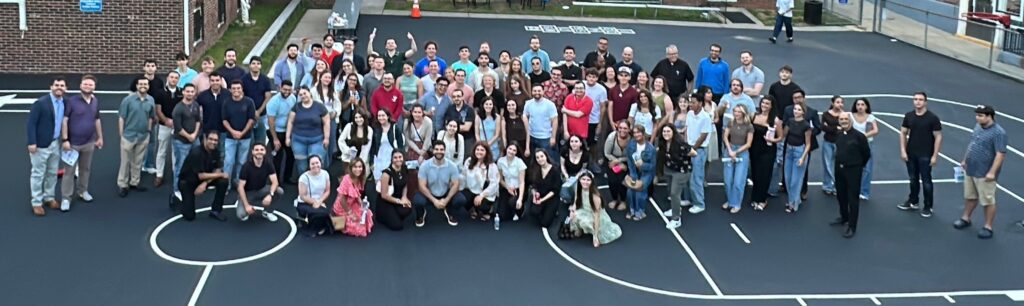 A large group photo taken after a Young Adult Ministry gathering at St. Clare Church, Staten Island, June 2026.