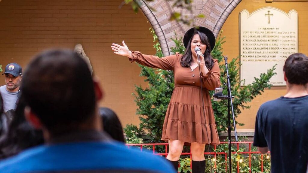 Marisel Rodríguez singing during the "Love and Responsibility" summer series hosted by the Young Adult Ministry of the Archdiocese of New York.