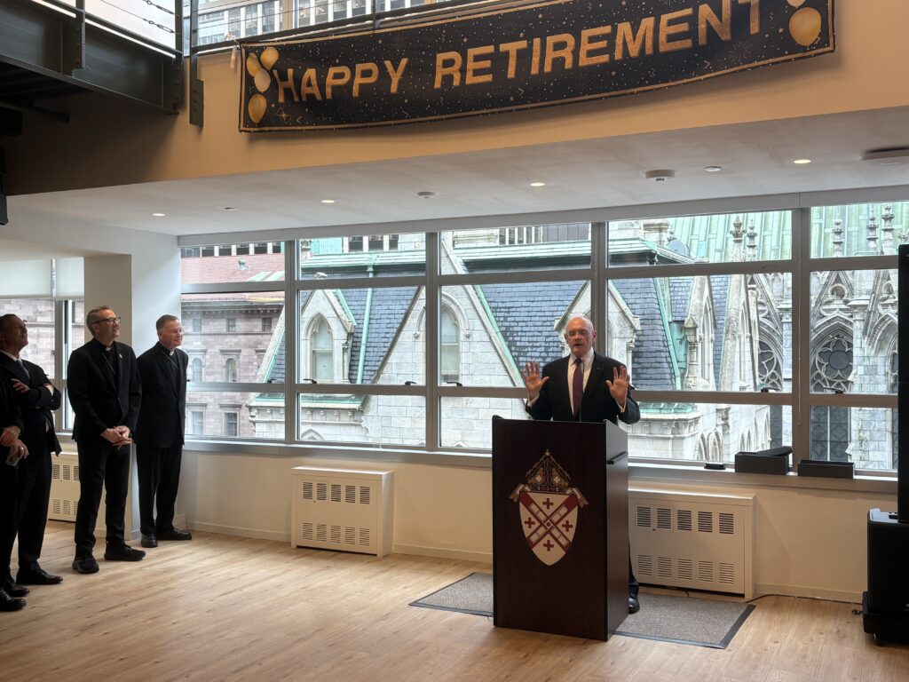 Roderick Cassidy, retiring general counsel of the Archdiocese of New York, speaks at his retirement party at the archdiocese's offices, on Sept. 28, 2026. Archbishop Ronald Hicks (left center), Auxiliary Bishop and Vicar General Edmund Whalen (left top), and Chief Administrative Officer Frank Napolitano (left bottom) look on.