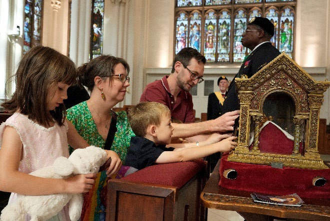 Joshua and Sarah Zielinski and their children venerate the major relics of St. Margaret Mary Alacoque at the Cathedral Basilica of the Immaculate Conception in Denver, Colorado, on Aug. 2, 2026.