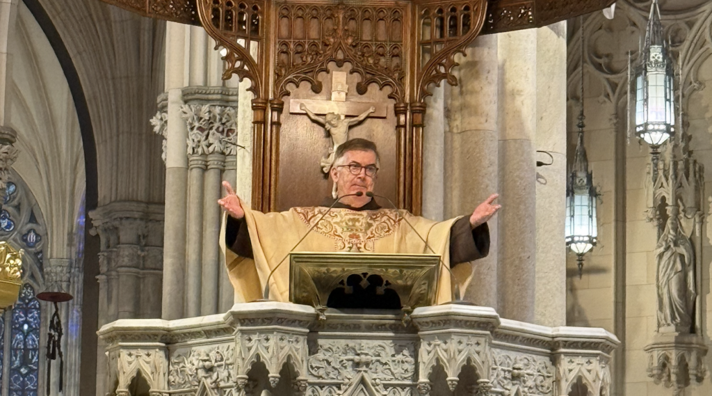 Fr. Brian Jordan, OFM, greets representatives of organized labor, tradespeople, and guests attending the annual Hard Hat Mass at St. Patrick's Cathedral on May 1, 2025.