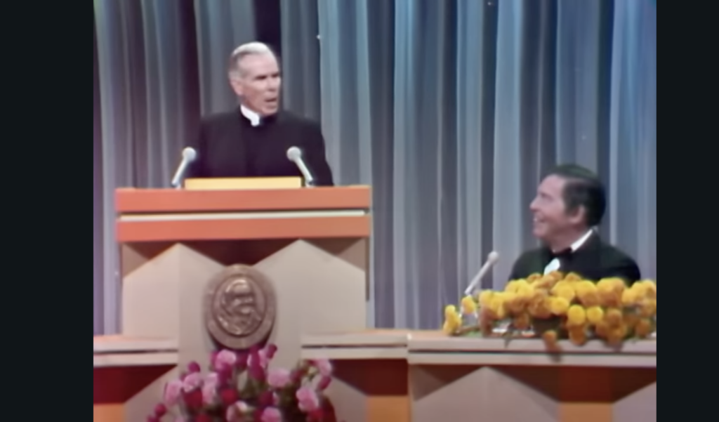 Then-Bishop Fulton J. Sheen roasts Milton Berle in October 1969. The Catholic broadcaster's career put him up against early television stars including Berle and Lucille Ball, and won him an Emmy Award in 1953.
