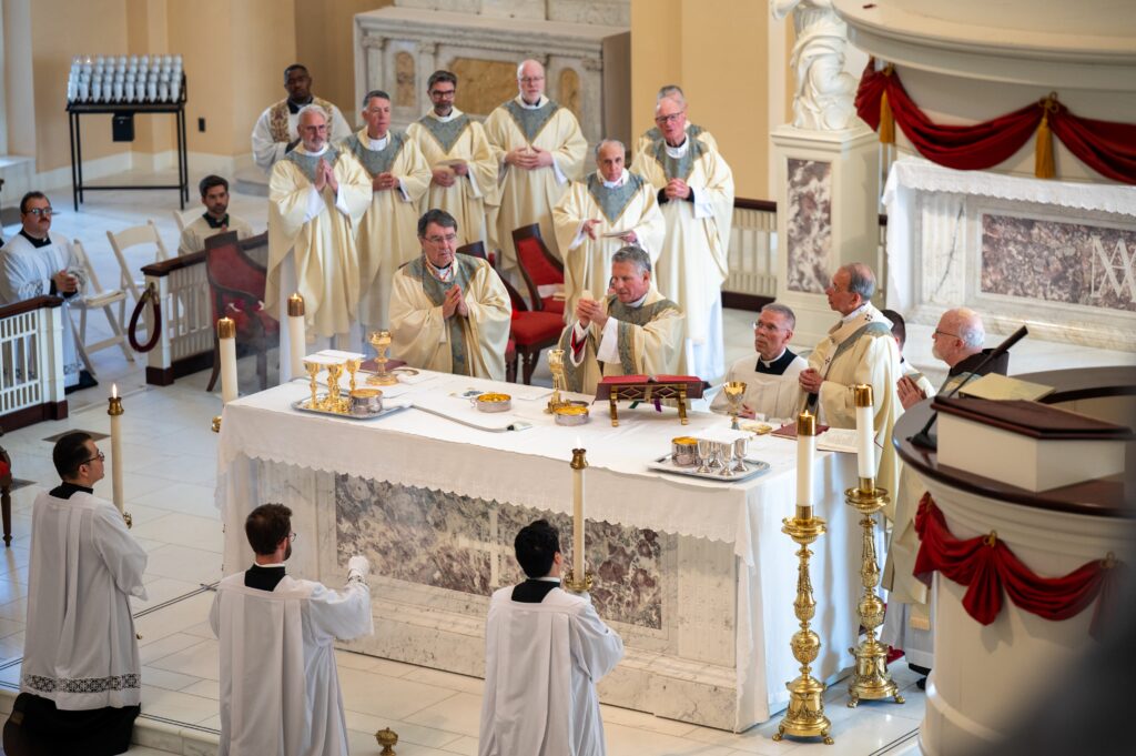 Cardinal Christophe Pierre, apostolic nuncio to the United States, left, Archbishop Timothy P. Broglio of the U.S. Archdiocese for the Military Services, outgoing president of the U.S. Conference of Catholic Bishops, and Baltimore Archbishop William E. Lori, outgoing USCCB vice president, concelebrate Mass at the Basilica of the National Shrine of the Assumption of the Blessed Virgin Mary in Baltimore on Nov. 10, 2025, to open the USCCB's fall plenary assembly.