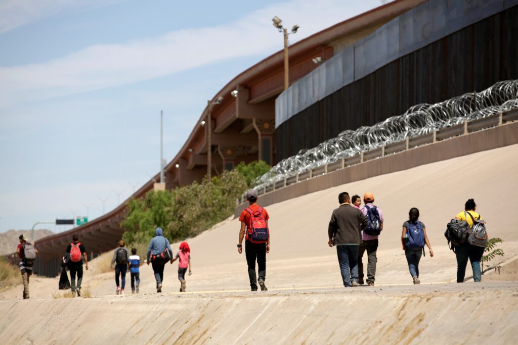 Migrants walk after crossing the Bravo River at the border line between Ciudad Juarez, Mexico, and El Paso in Texas, U.S., as seen from Ciudad Juarez, May 9, 2019. In a statement marking National Migration Week Sept. 21-27, 2026, Bishop Brendan J. Cahill, chairman of the U.S. bishops' urged U.S. officials and lawmakers to enact policy that upholds the "God-given human dignity" of migrants and prevents the separation of families.