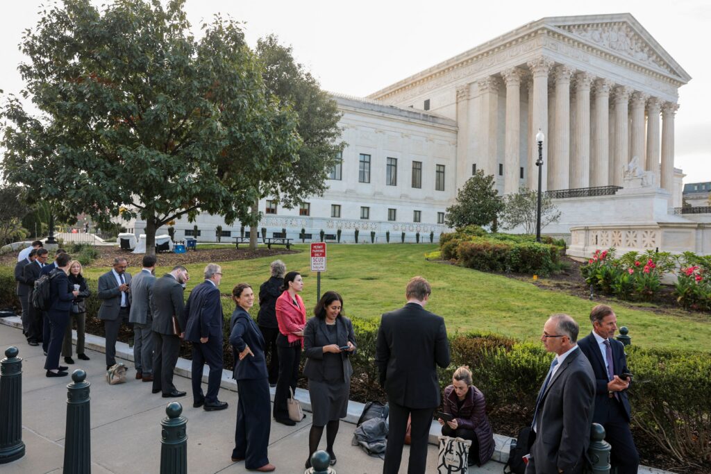 Supreme Court Bar members wait to be first in line for the first day of the US Supreme Court's new term in Washington Oct. 5, 2026.